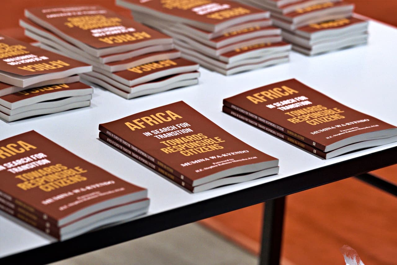 Copies of Africa In Search for Transition: Towards Responsible Citizens laid out on a table