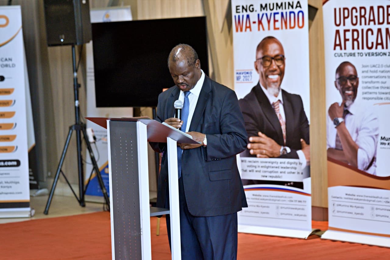 A guest speaker addressing the audience from the podium at the book launch