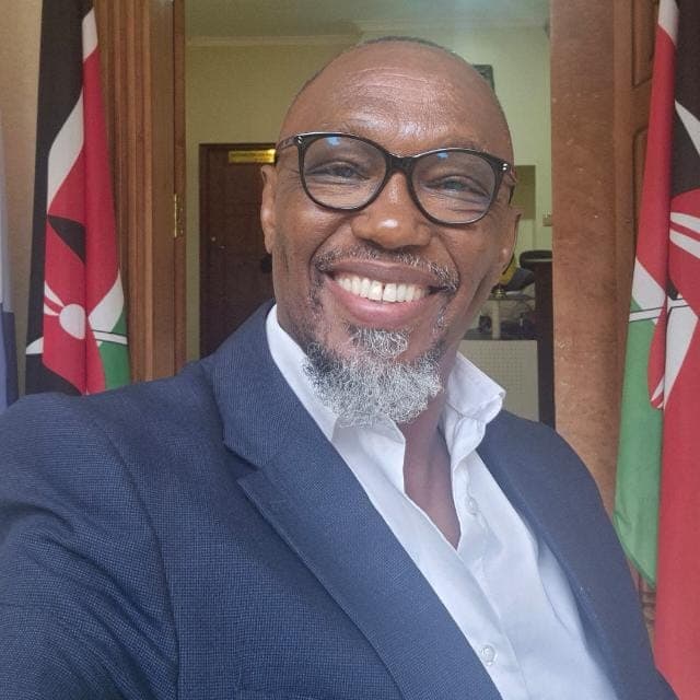 Engineer Mumina Wa-Kyendo - Professional Portrait with Kenyan Flags